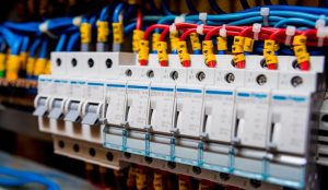 Residential electrical switchboard with safety switches and circuit breakers in a Victorian home.